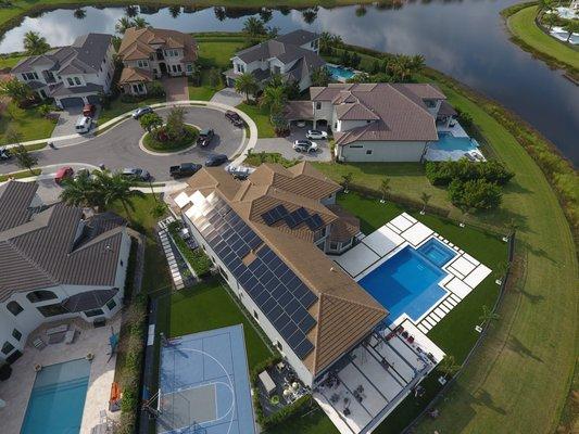 solar panel installation on estate home community, tile roof, delray beach