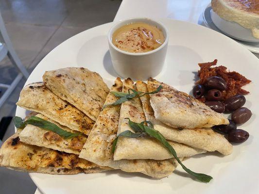 Hummus with Flatbread, olives and sun dried tomatoes