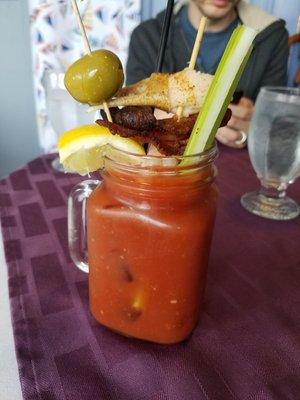 Bloody Mary with all the fixings. Shrimp, bacon, crab. Yum!