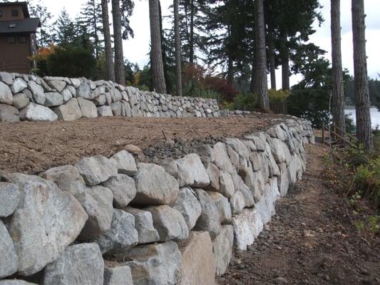 A rock retaining wall that was built when Allen Shearer had the yard landscaping portion of the business.