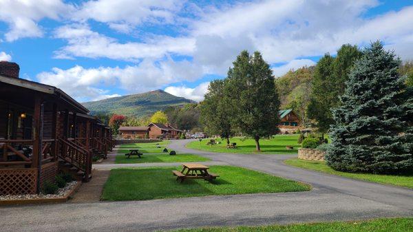 Cabins and resort showing mountains in the background.