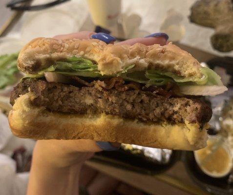 Overcooked, dry bacon cheeseburger