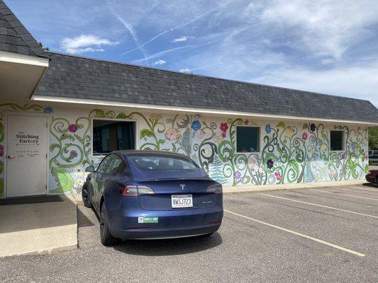 Cute painted mural in parking lot adds charm