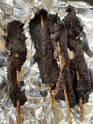 Beef on a stick just delivered.   Would you eat this?  Completely charred.  Rest of meal was goof