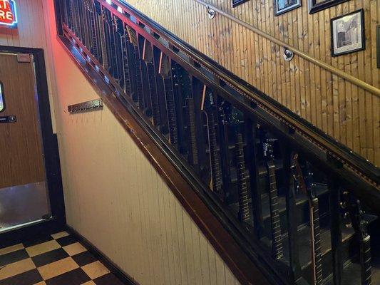 The bannister is made of guitar handles! How cool!!