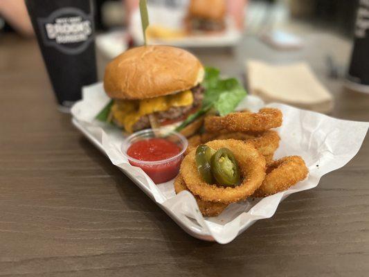 The Wagyu Experience with crisp onion rings and jalapeños on the side