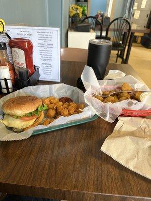 Pepper jack burger, tots and basket of fried pickles