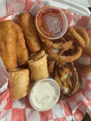 Appetizer sampler: southwest egg rolls, mozzarella sticks, onion rings and loaded potato skins