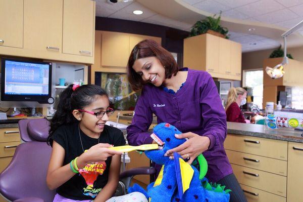 Our patient showing Dr. Merchant her brushing skills!