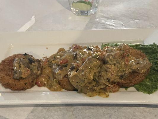 Appetizer crawfish & mushrooms creamed sauce over fried eggplant