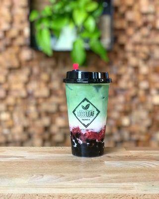 Strawberry Matcha Latte made with Japanese Matcha, Straus Organic Milk, and Real Strawberry Compote.