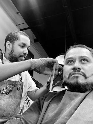 Barber Lorenzo doing a bang up job on fellow barber.