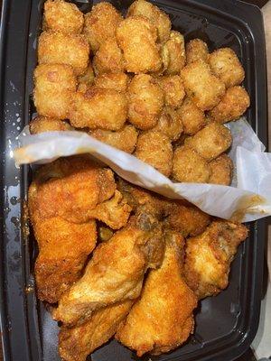 Texas Mesquite dry rub 9 piece wings  & garlic parm tots