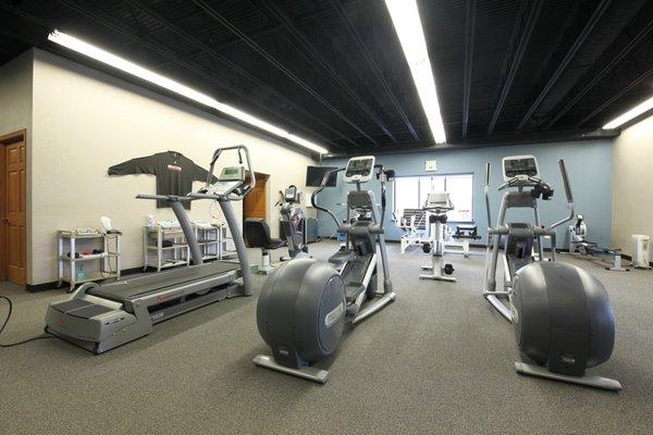 We have two gyms in our clinic to use for your road to recovery.  This is the front gym.