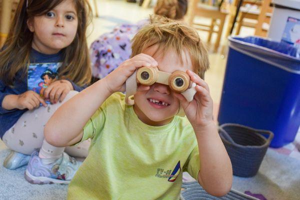 Kid having fun in the classroom.