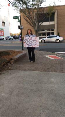 FREE HUGS outside the Courthouse while they extort the working class inside the Courthouse. Murica!!