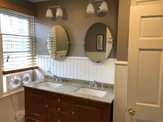 New vanity with double sinks and faucets.