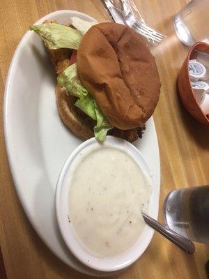 Fried tenderloin on a bun with lettuce, tomato, and mayo. Add a side of gravy. Perfect!!!!