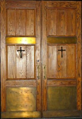 Large wooden doors leading into the church sanctuary.