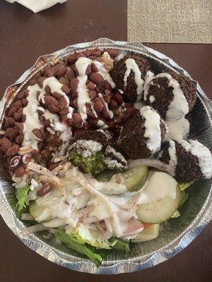 Falafel salad with rice and beans.