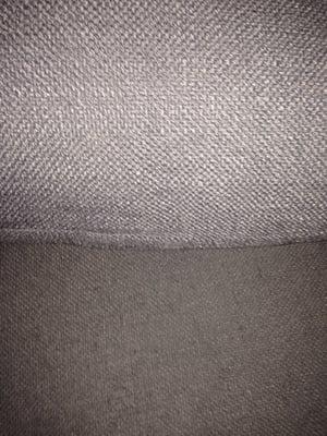 This shows the seat cushion vs the arm cushion that I've had in storage. See the fuzzies and discoloration?