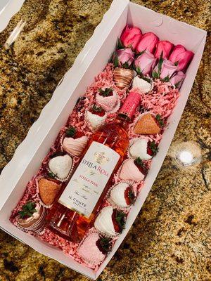 Chocolate covered strawberries, roses, and wine