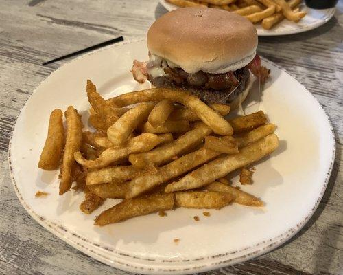 Angus burger with potato bun bacon and provolone cheese with fries