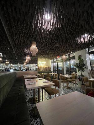 Velvet benches and hanging rope ceiling, very modern interior