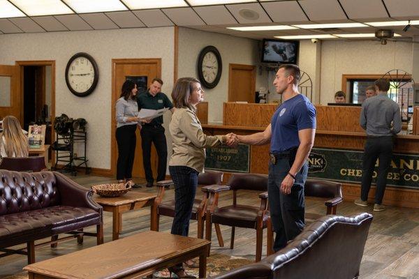 Bank of Cherokee County's Chairman and CEO, Susan Plumb, shaking hands with a customer at the Park Hill branch in Tahlequah, Oklahoma.