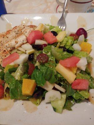 Summer salad with orange, pineapple, watermelon, grapes and chicken breast