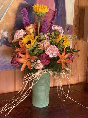 Another bouquet I ordered. Not sure about the random tall sunflower, but the rest looks beautiful. The vase is especially nice.