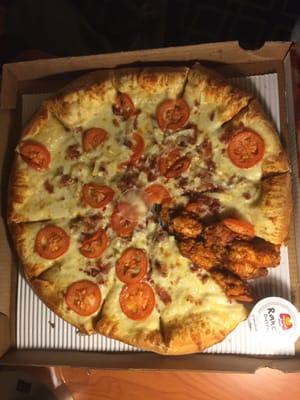 A white pizza with six tiny wings in place of a slice, the pizza is very very great, I mean freaking good!