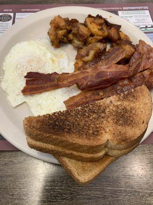 2 eggs, home fries, bacon, and toast