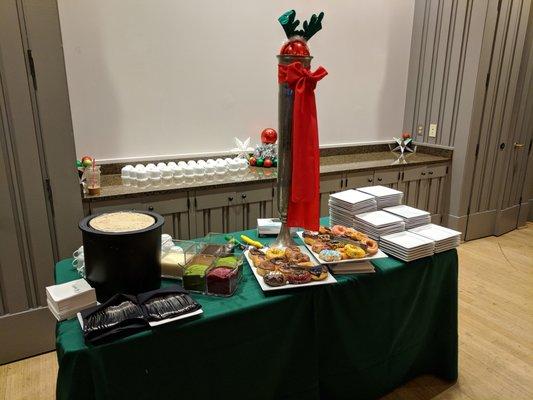 Company holiday party catering at Atlanta Botanical Garden. Dessert station with coffee ice cream, toppings, and assorted doughnuts.