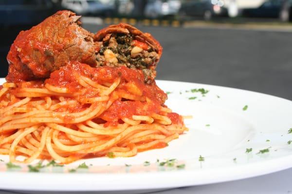 Braciola Napoletana served over Spaghetti al Pomodoro