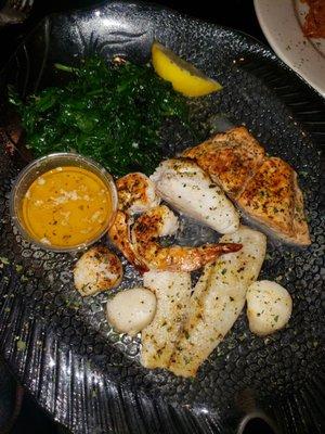 Broiled seafood platter special with spinach instead of fries