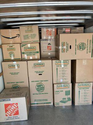 Boxes loaded neatly in the back of a truck