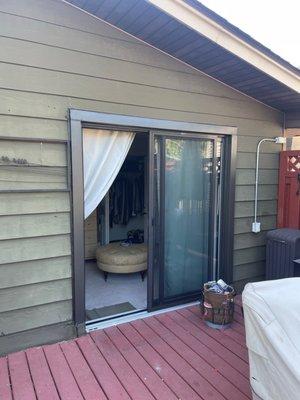 Finished bronze patio door with bronze capping.