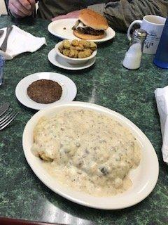 biscuits with sausage gravy and sausage; hamburger with a side of fried okra.