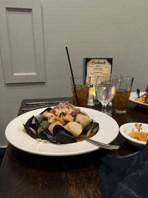 FRUTTI di MARE - Sautéed mussels, little neck clams, shrimp, scallops, calamari and lobster meat in a spicy marinara sauce