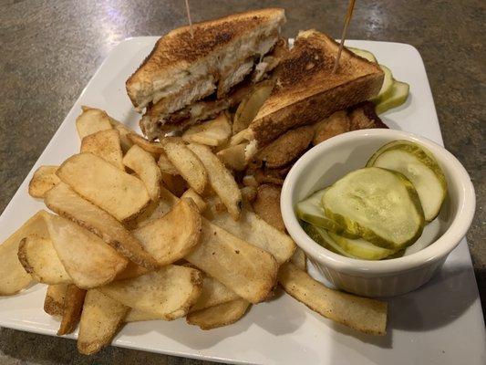 Chicken tender melt with flat fries.