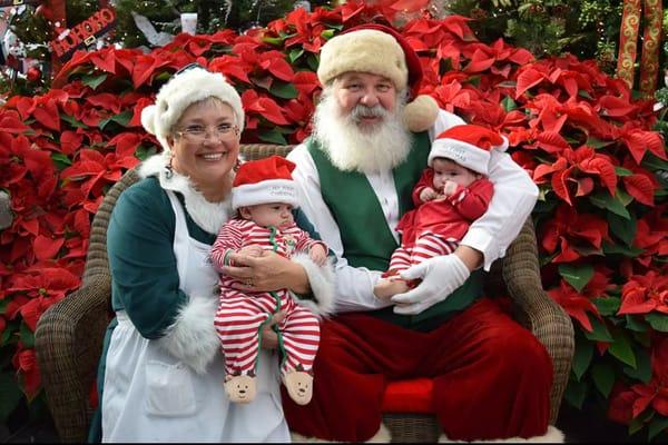 Pictures with Santa and Mrs. Claus in the greenhouse!