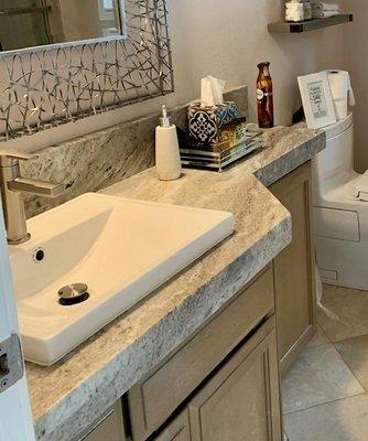 Odd shaped counter was created perfectly to fit this cabinet.