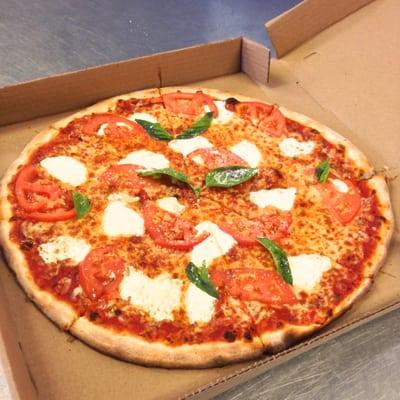 Hi Ryan S., The margherita pizza you posted is the old owner's recipe, who left months ago.  This is our magherita, New-York Style.