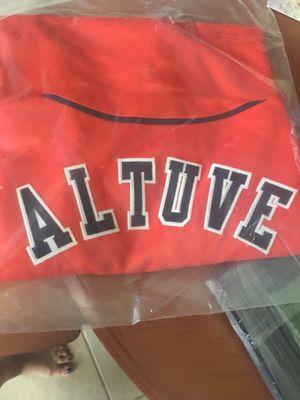 Won Altuve signed jersey at charity auction.