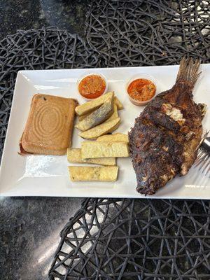 Grilled tilapia well flavored. Moi moi fried yam