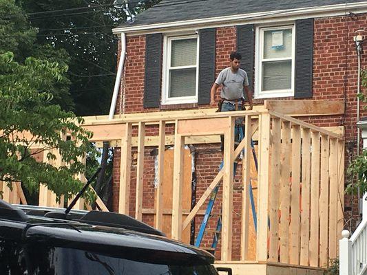 Workers about to frame roof