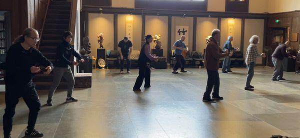 Tai Chi class, practicing the Hunyuan Taiji Regular 24 form.