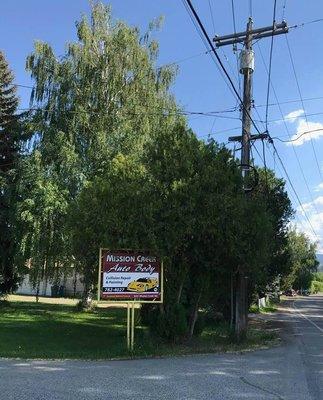 STREET SIGN OF MISSION CREEK AUTO BODY