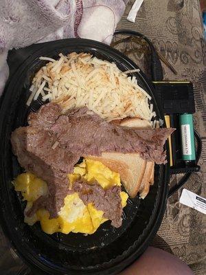 "Rare" steak, onions and cheese in hash browns, and "standard" scrambled eggs